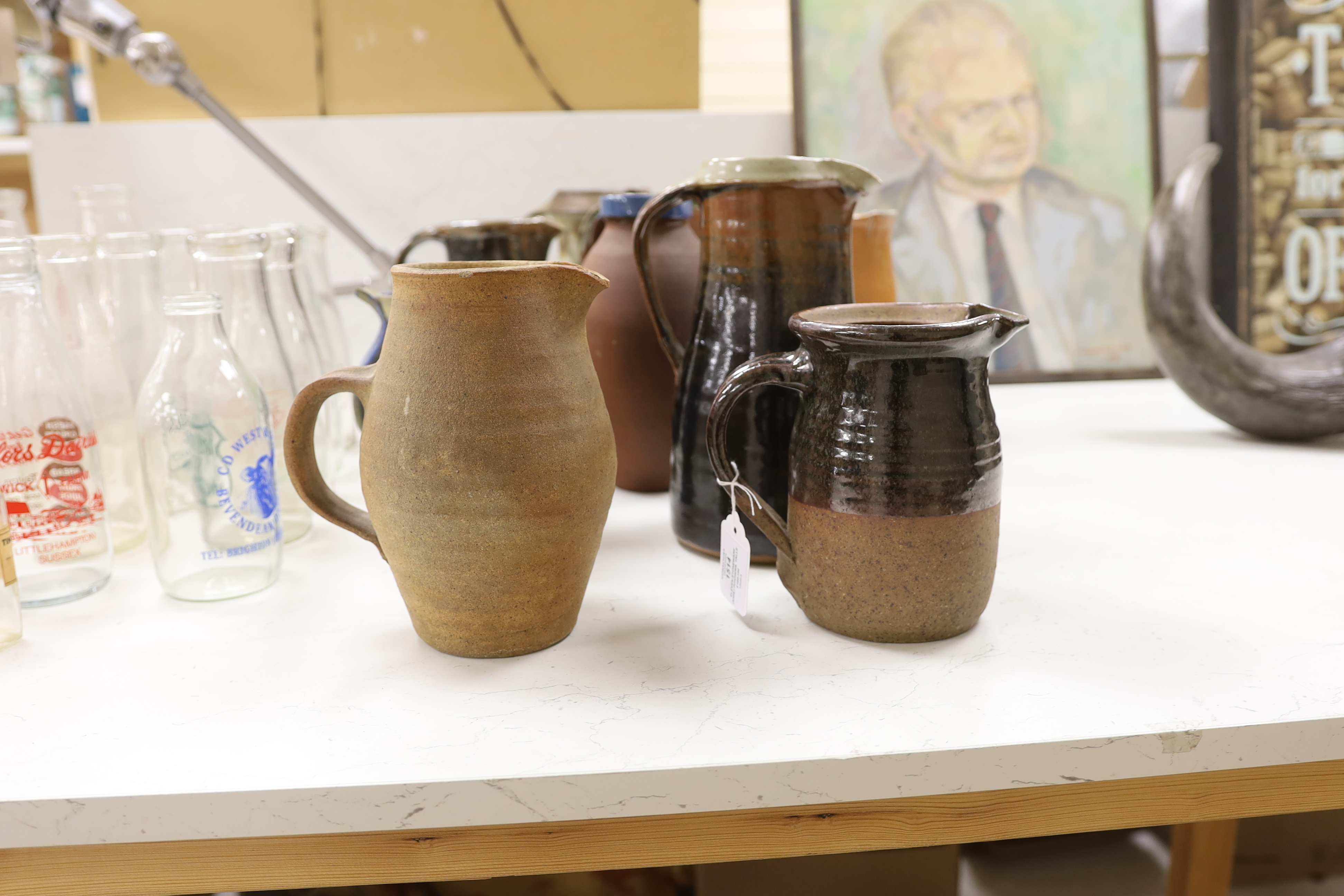 Eleven studio stoneware jugs / pitchers, including Muchelney tallest 26cm